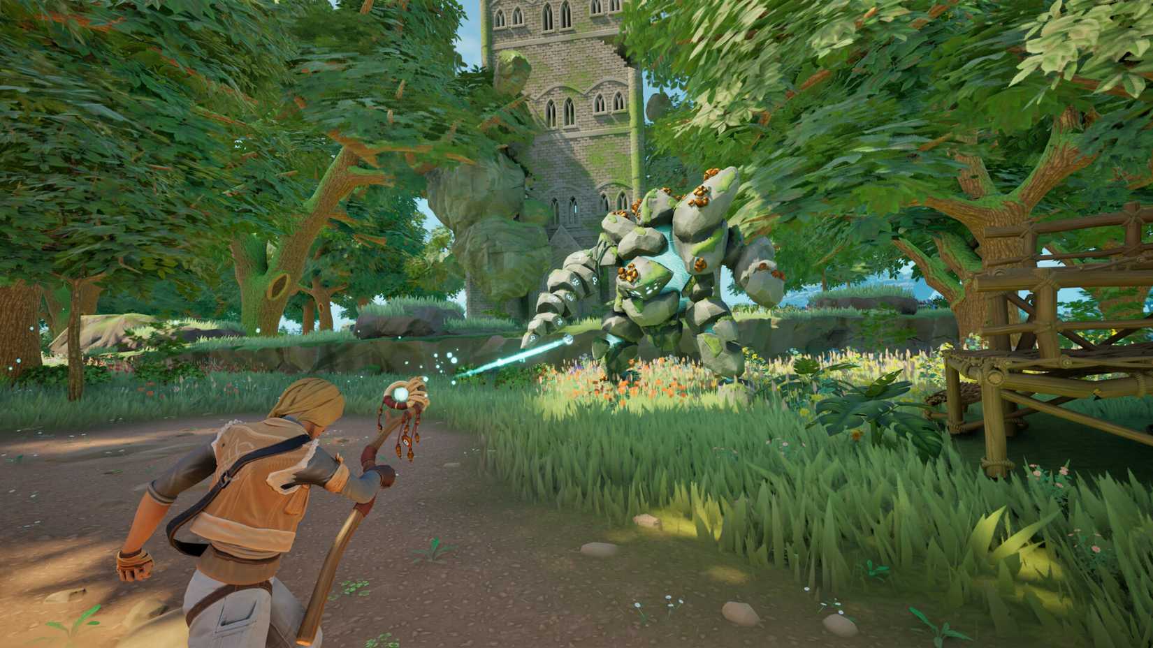 staff shooting magic at a stone golem